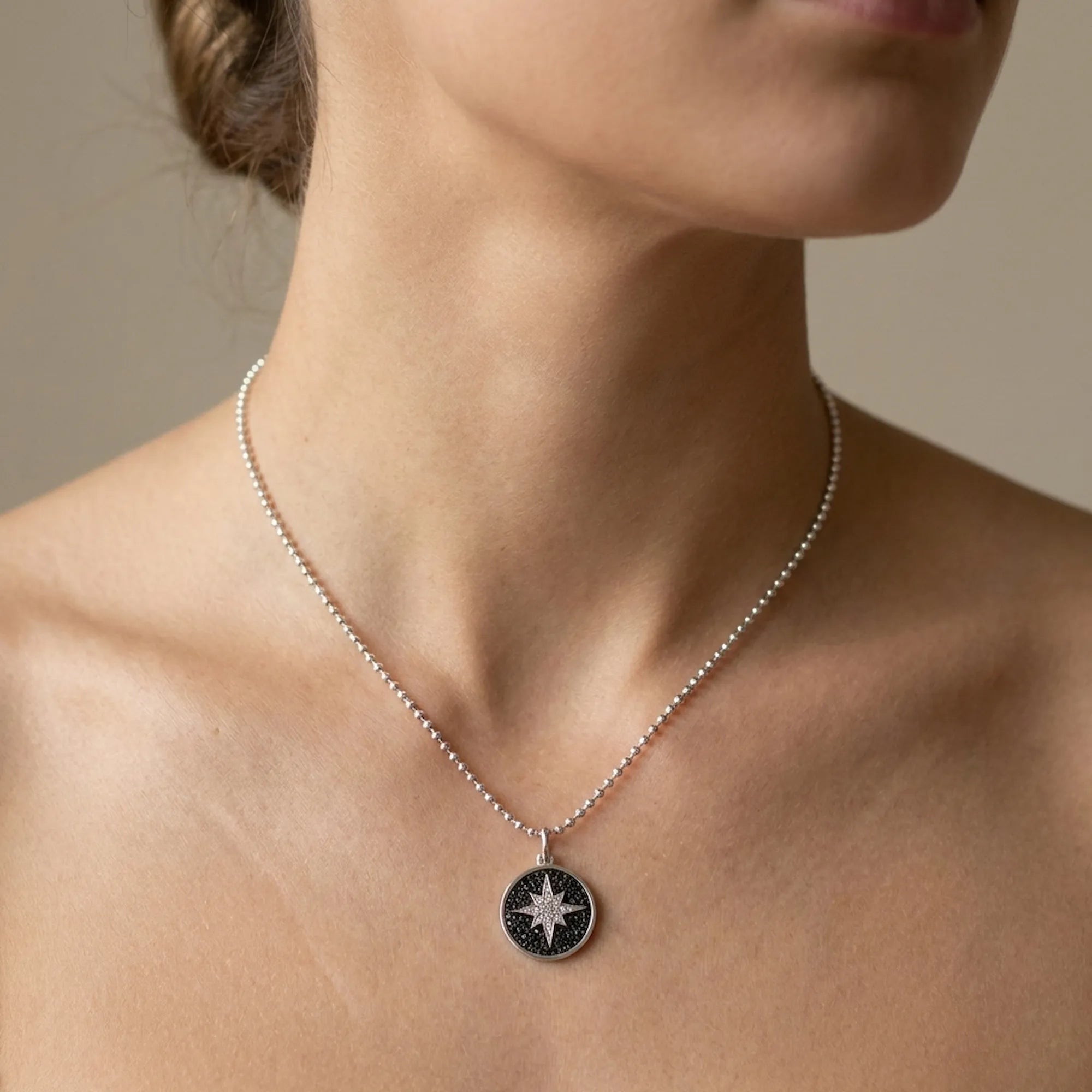 Female model wearing the Luna Dura Polaris 925 silver necklace, demonstrating the perfect collarbone fit and pendant scale jewelry dubai.