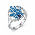 Sterling silver hamsa ring with azure enamel and a round tanzanite eye on a white background UAE.