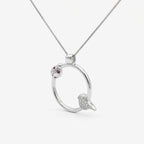 Forty-five degree angle of the rhodium plated ladybug necklace highlighting the spring design bird charm