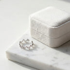 Close-up of an open-band 925 silver leaf-vine ear cuff, no-piercing adjustable design. Luna Dura.