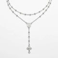 Long 60 cm Italian 925 silver rosary-style Y necklace with polished beads, oval Miraculous Medal and small crucifix on white.