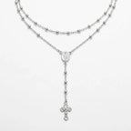 Long 60 cm Italian 925 silver rosary-style Y necklace with polished beads, oval Miraculous Medal and small crucifix on white.