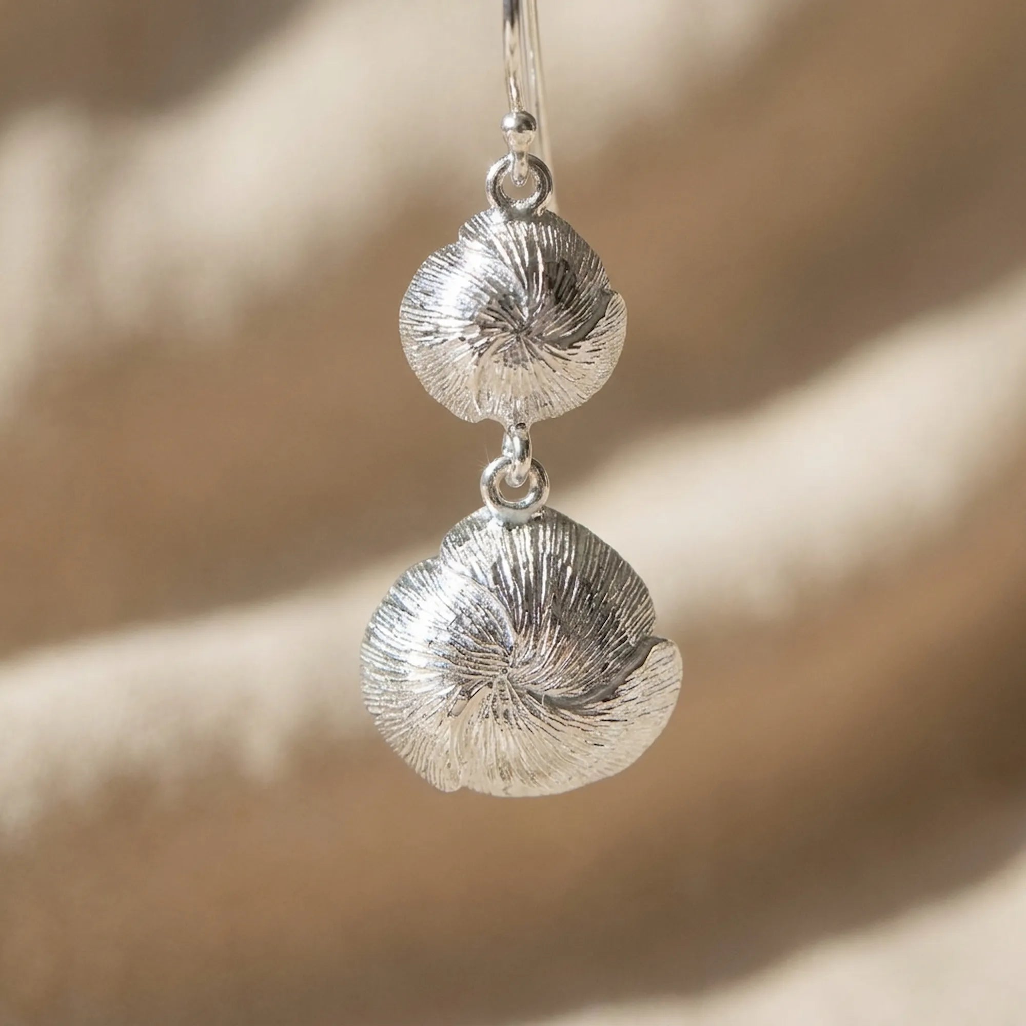 Hand-engraved lotus reverse of the Luna Dura amethyst dangle earring settings in 925 silver.