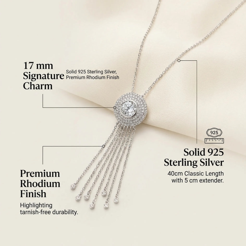 Infographic for the Surayya silver tassel necklace detailing the 17mm signature charm, 925 sterling silver, and tarnish-free rhodium finish.