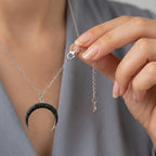 Adjustable 925 silver chain extender and lobster clasp detail on crescent necklace
