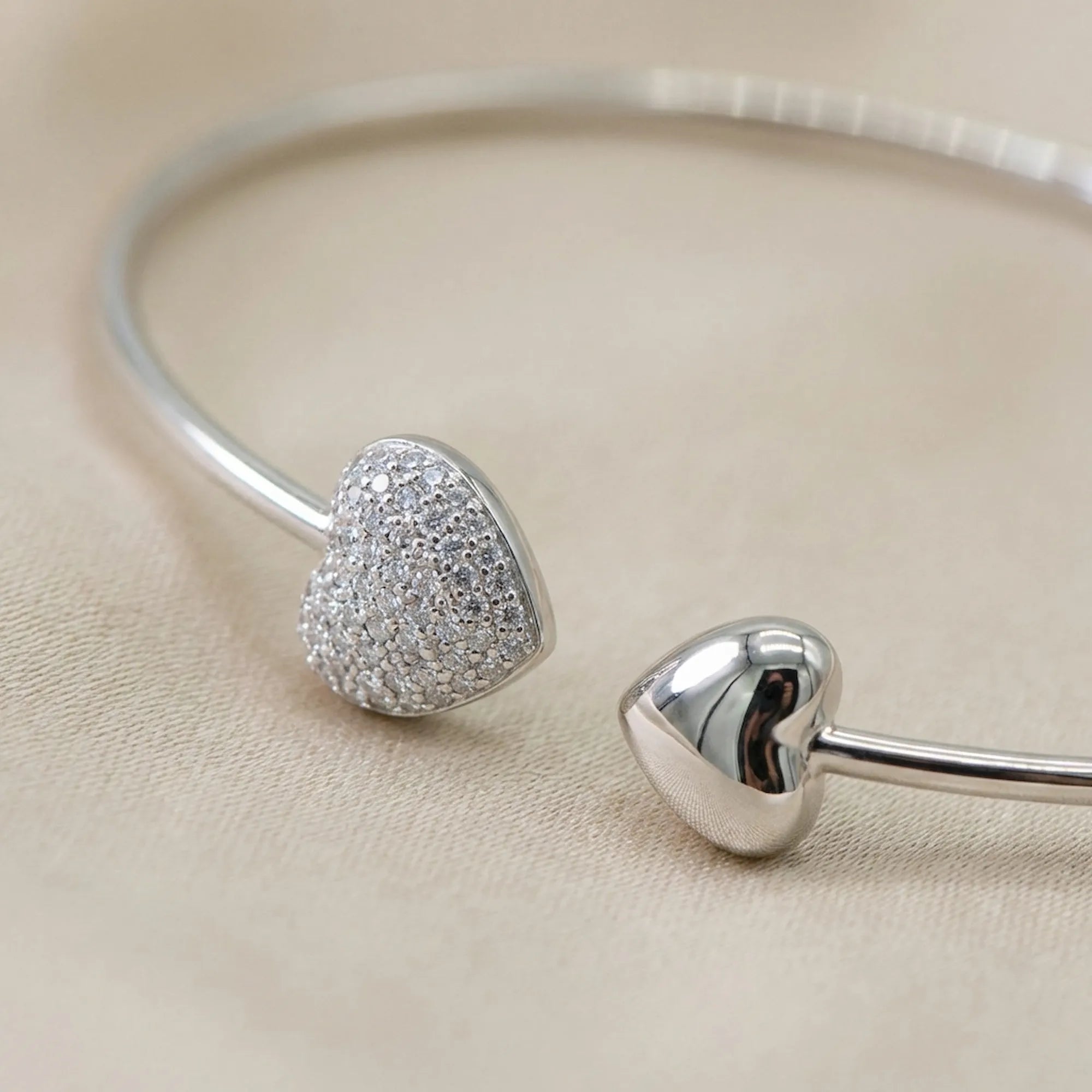 Macro detail shot highlighting the premium rhodium finish on the 925 silver solid collar necklace, focusing on the intricate CZ pave heart pendant.