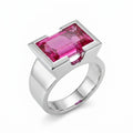 Emerald cut magenta quartz ring in 925 sterling silver, half bezel setting, angled view, white background