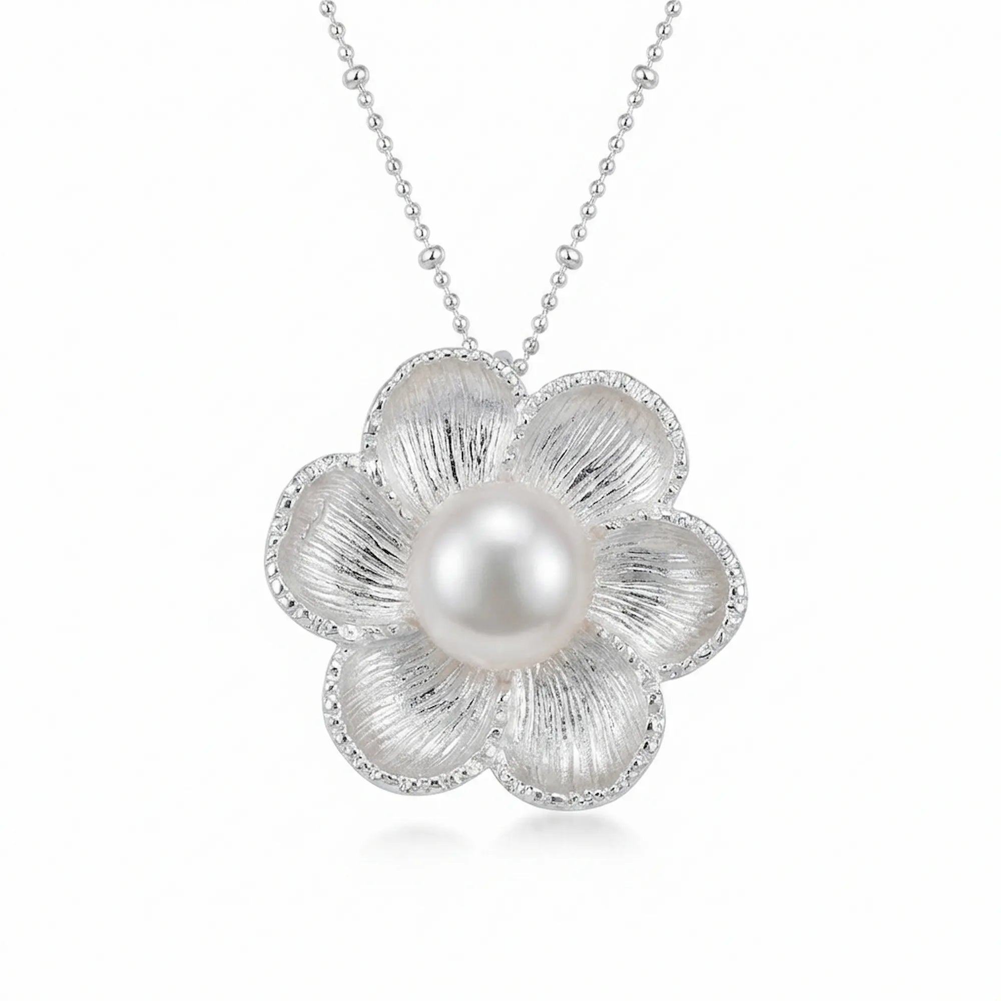 Six-petal magnolia pearl pendant necklace in 925 silver, white background front view