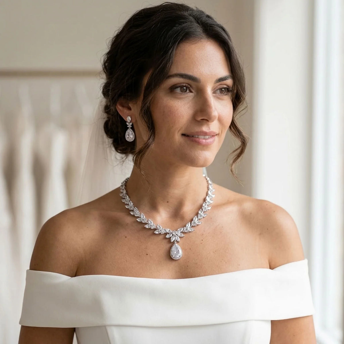 Bride wearing a rhodium-plated cubic zirconia marquise foliage and halo teardrop necklace set indoors in Dubai.