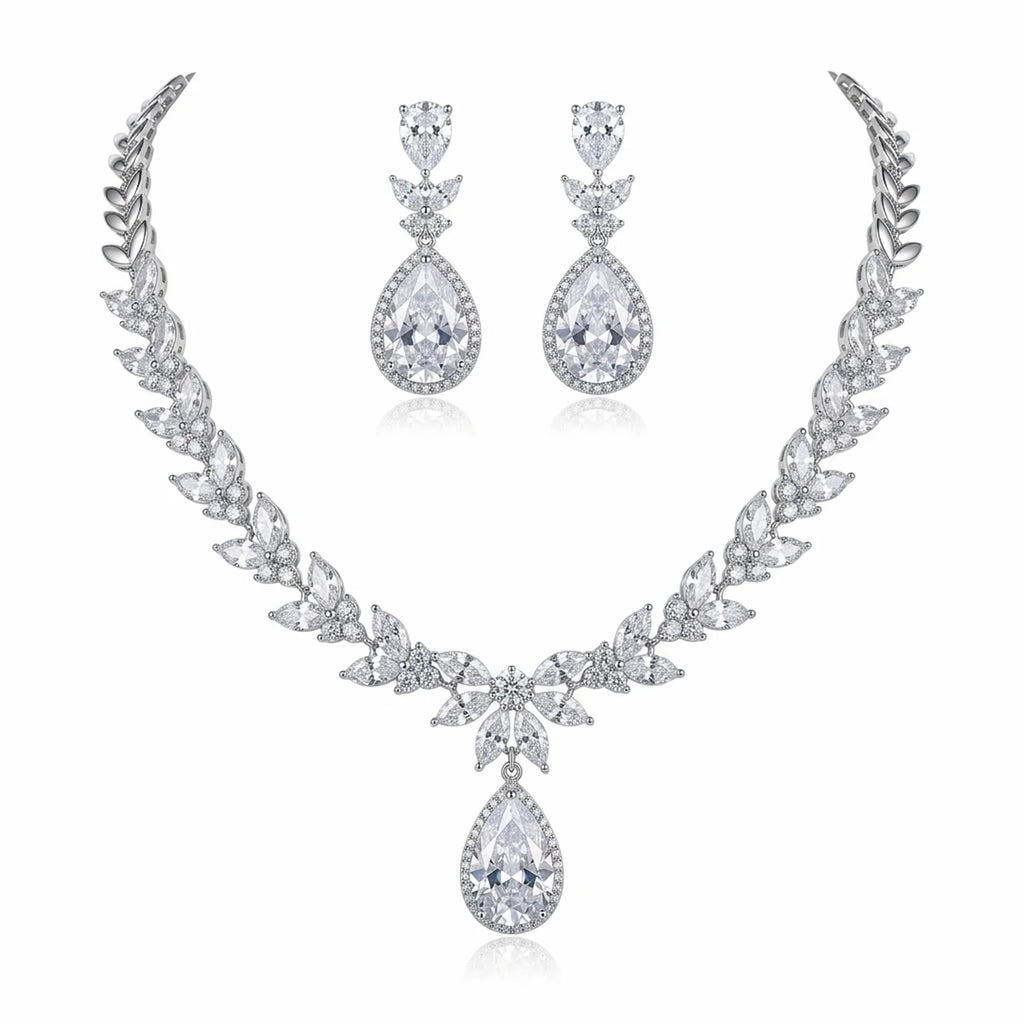 Rhodium-plated cubic zirconia necklace and earrings set featuring marquise leaf clusters and halo teardrop drops in Dubai.