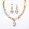 18k gold-plated cubic zirconia necklace and earrings set featuring marquise leaf clusters and halo teardrop drop in Dubai.