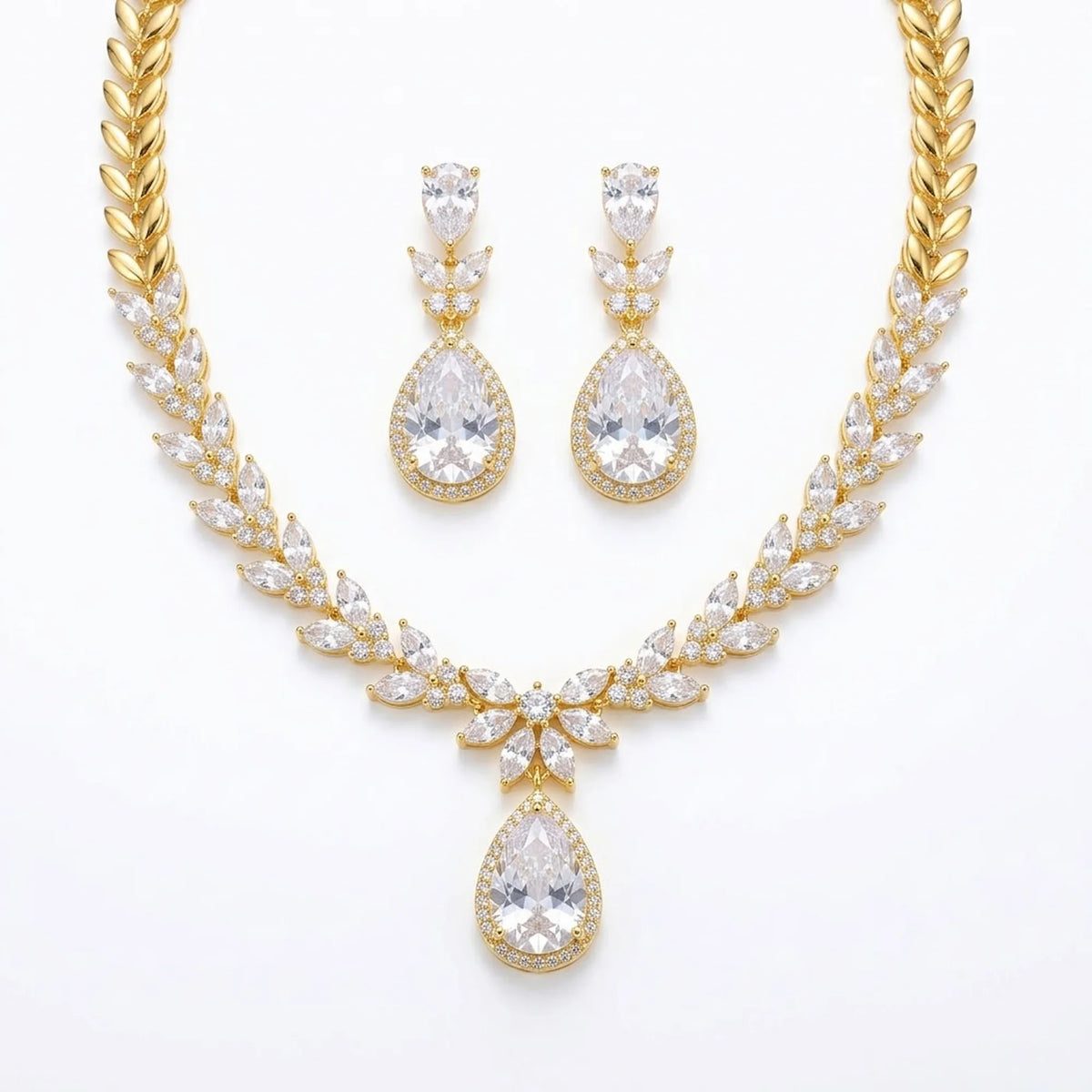 18k gold-plated cubic zirconia necklace and earrings set featuring marquise leaf clusters and halo teardrop drop in Dubai.