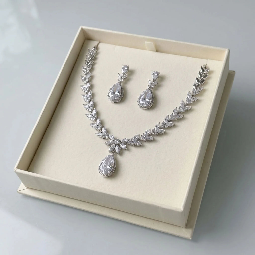 Rhodium-plated cubic zirconia marquise leaf and halo teardrop bridal necklace set displayed in a gift box in Dubai.