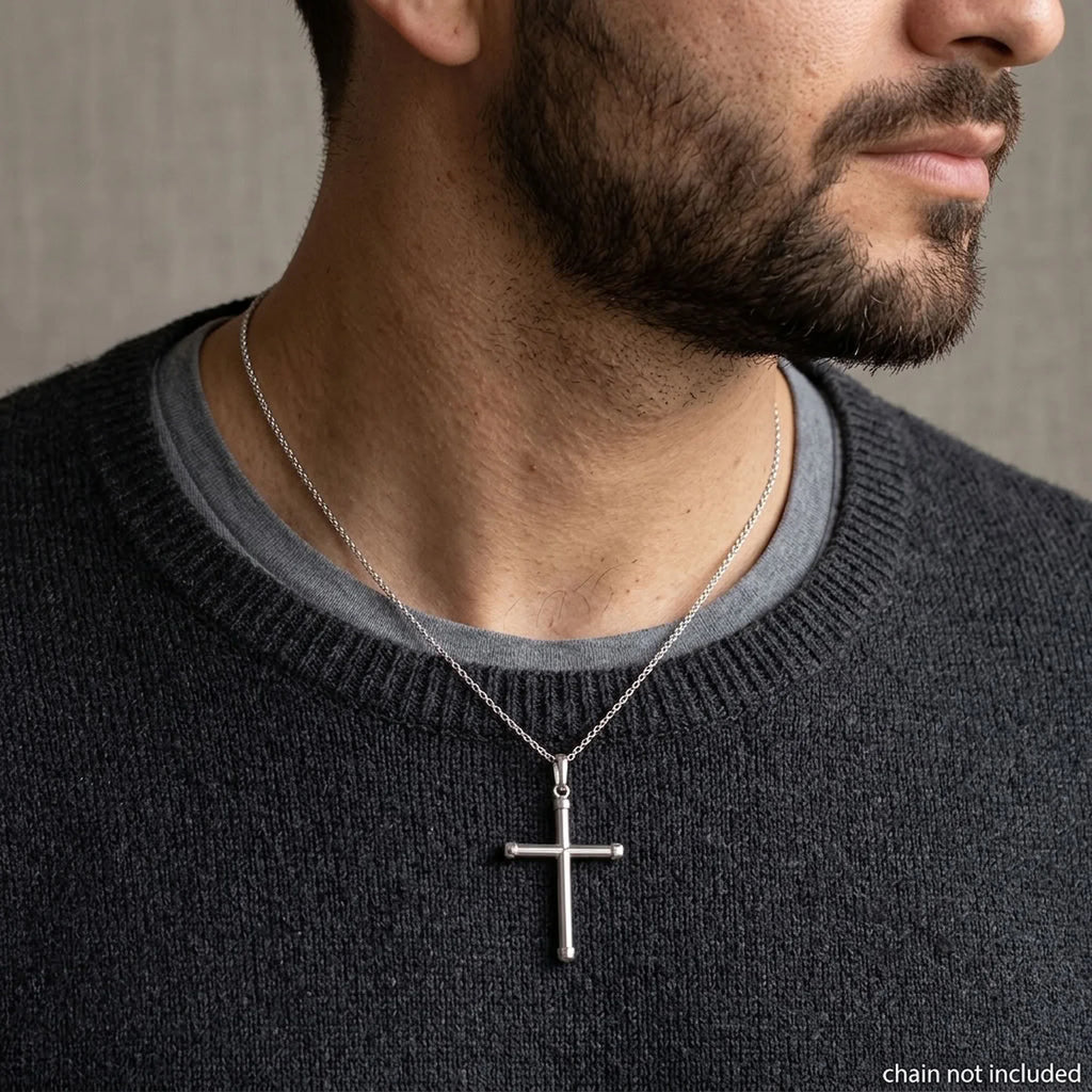 Man wearing a 925 sterling silver cross pendant on a styling chain, chain not included in Dubai.