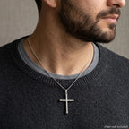 Man wearing a 925 sterling silver cross pendant on a styling chain, chain not included in Dubai.