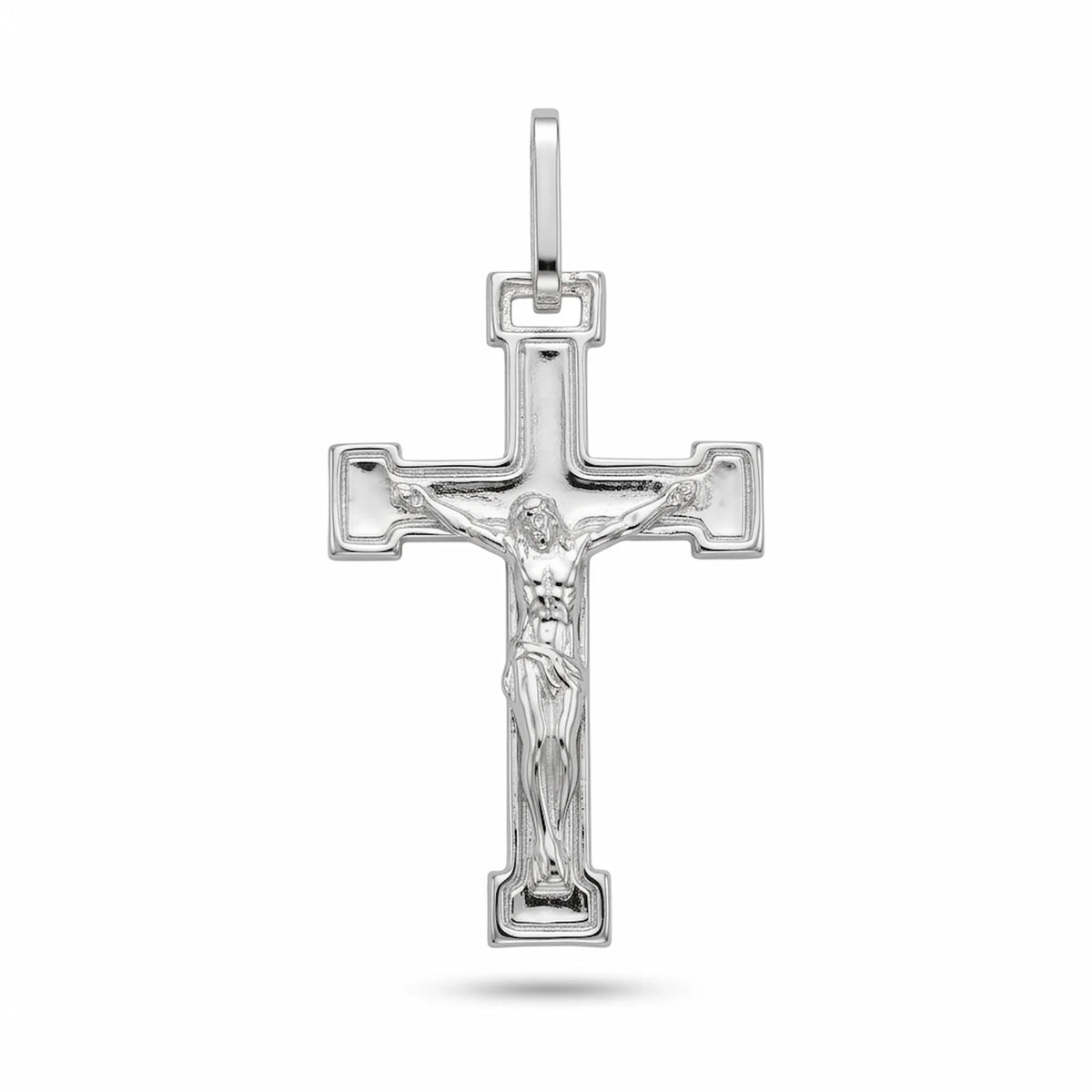 Men's sterling silver crucifix pendant with raised Corpus and stepped polished frame on white background in Dubai.