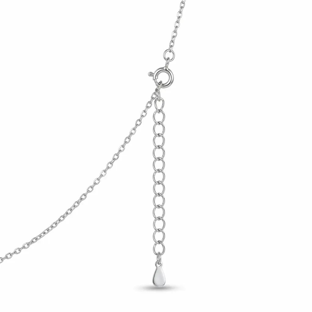 Close-up of the sterling silver mini rolo chain, spring-ring clasp and extender tail on an evil eye necklace.