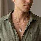 925 sterling silver Miraculous Medal necklace worn by a man.