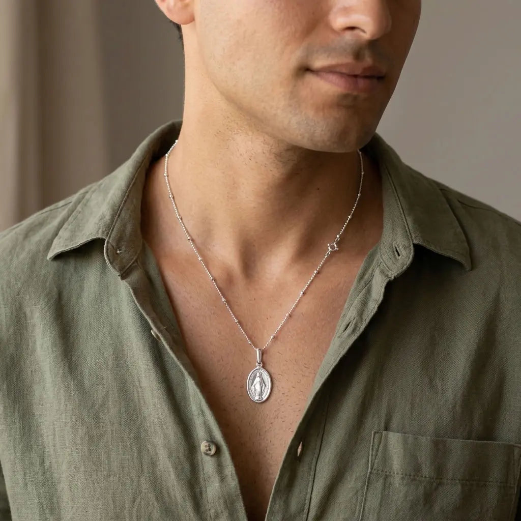925 sterling silver Miraculous Medal necklace worn by a man.