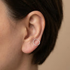 Model wearing 10mm 925 silver ear cuff on lower lobe — scale and daily wear fit reference