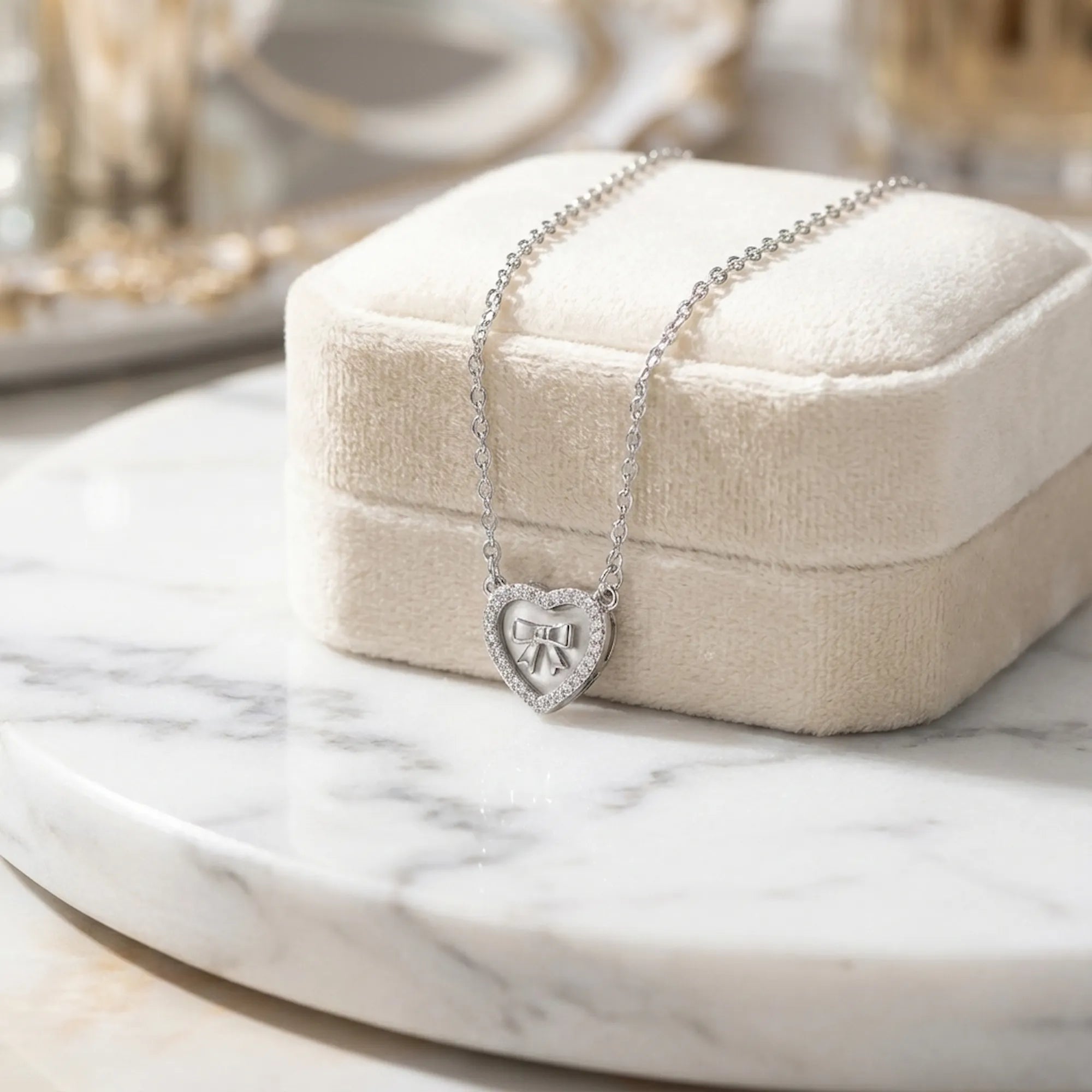 Mother of Pearl heart pendant necklace on cream velvet jewelry box on marble — meaningful gift necklace Dubai UAE with lobster clasp visible