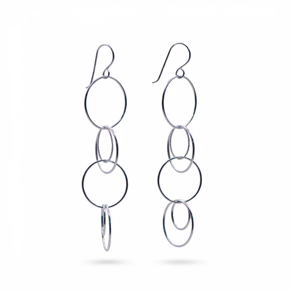 Multi-circle drop earrings in rhodium-plated sterling silver featuring a twisted-wire center ring, available in Dubai.