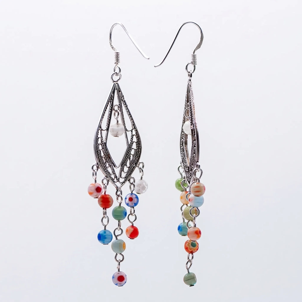Murano glass chandelier earrings with silver filigree and millefiori beads, Luna Dura Dubai.