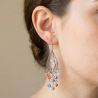Close-up of a silver filigree Murano glass chandelier earring with colourful beads, Luna Dura Dubai.
