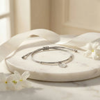 North Star heart silver bracelet flatlay on marble with jasmine and ribbon, gift-ready, Luna Dura Dubai