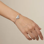 North Star pavé CZ heart bracelet worn on wrist showing 15cm fit and stationed heart charm — rhodium 925 silver Dubai