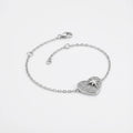 North Star pavé heart bracelet in rhodium 925 sterling silver — lobster clasp, 4cm extender chain and CZ heart charm on neutral background