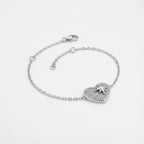 North Star pavé heart bracelet in rhodium 925 sterling silver — lobster clasp, 4cm extender chain and CZ heart charm on neutral background