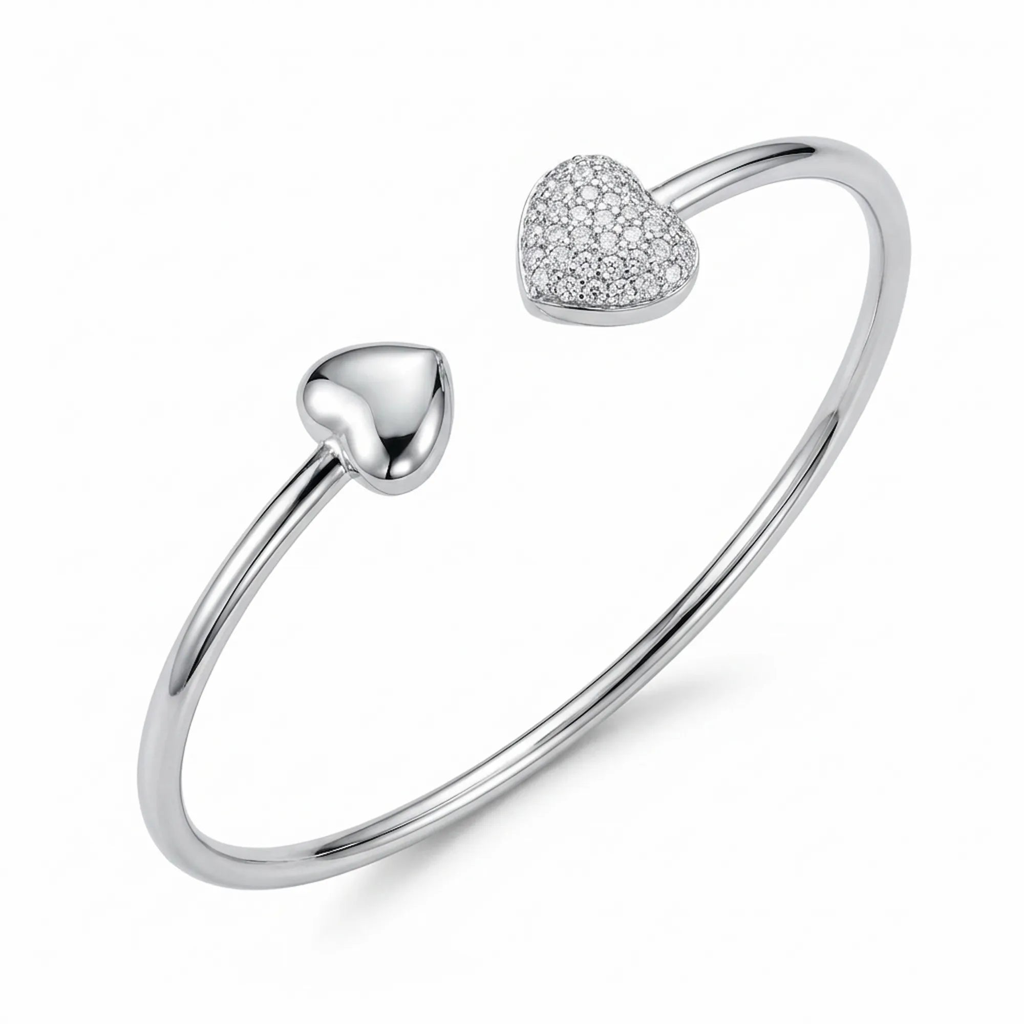 Close up of the matching 925 silver open cuff bangle showcasing the detailed cubic zirconia pave heart and plain silver locket ends.