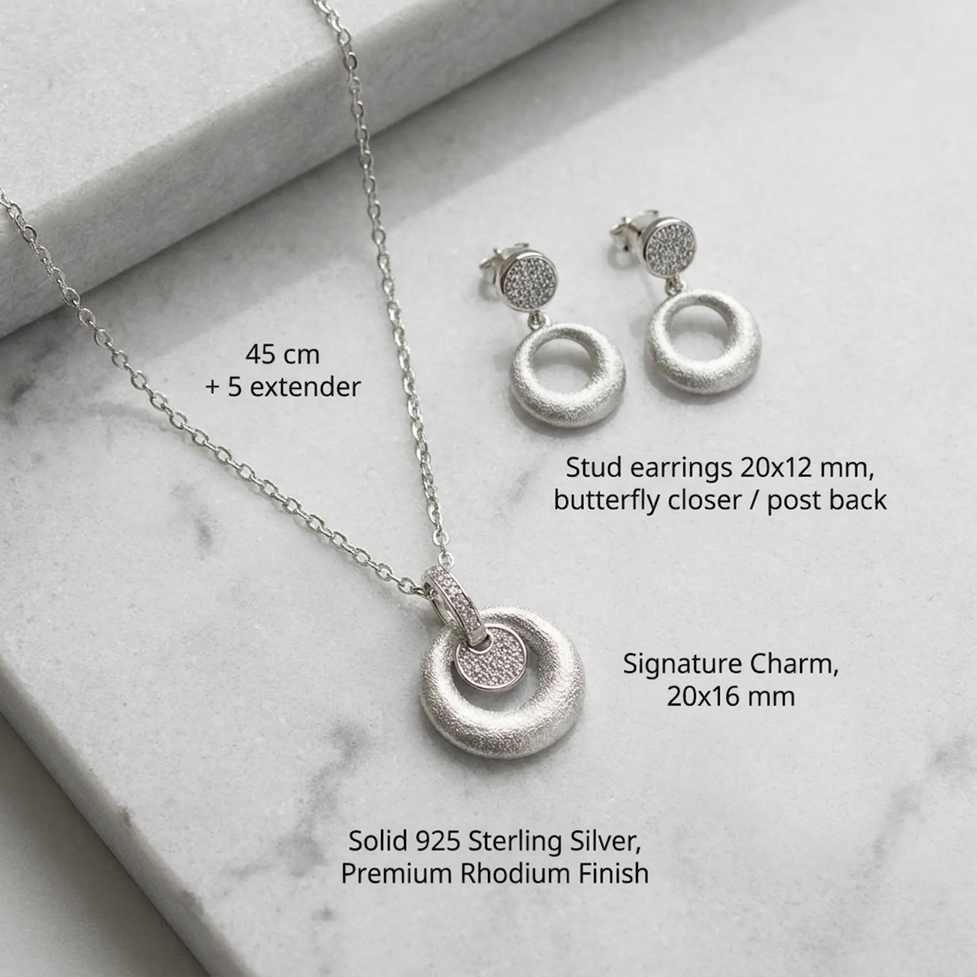 Feature breakdown of rhodium silver disc pendant earring set — 925 silver, dimensions and butterfly closer
