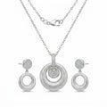 Brushed rhodium silver orbiting disc pendant necklace and circle drop earrings — 925 sterling silver set in Dubai white background.