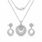 Brushed rhodium silver orbiting disc pendant necklace and circle drop earrings — 925 sterling silver set white background