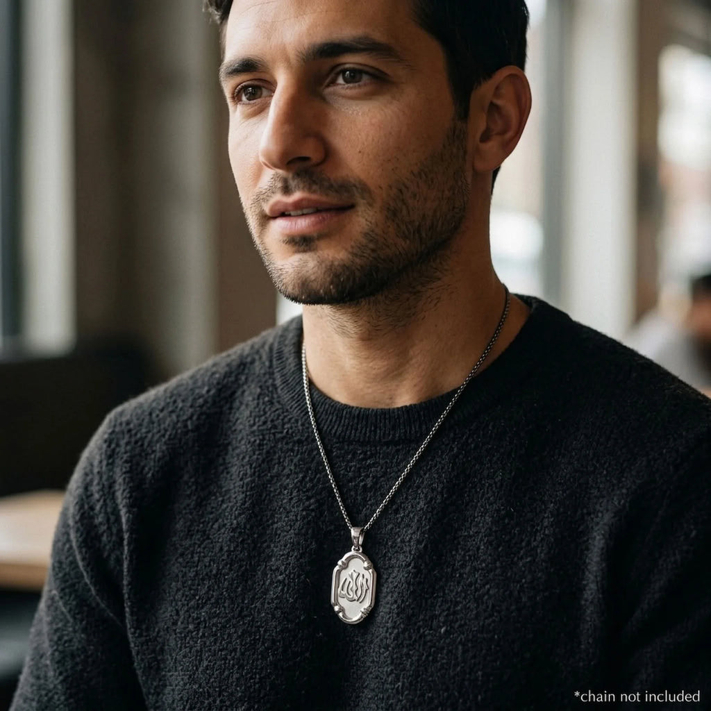 Man wearing an oval Allah sterling silver pendant on a styling chain, which is not included.