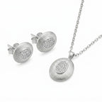 Brushed rhodium oval pendant necklace and matching CZ pavé stud earrings in 925 sterling silver — white background