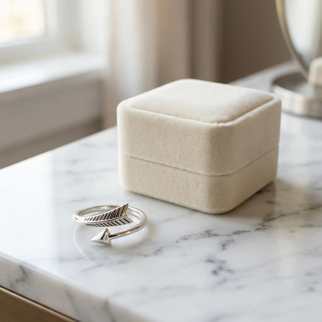 Oxidized silver arrow ring beside a cream gift box, gift-ready from Luna Dura Dubai
