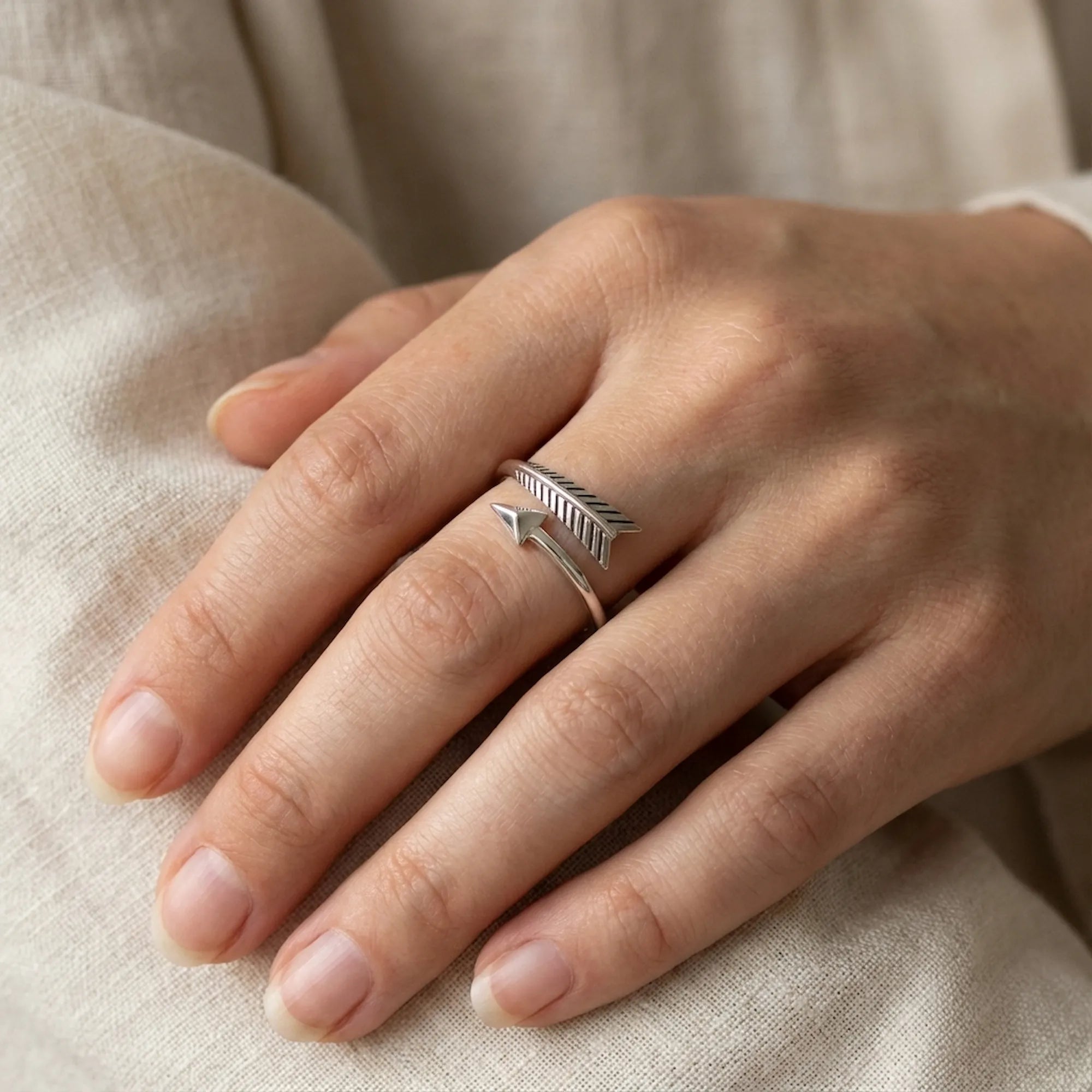 Unisex oxidized silver arrow wrap ring worn on the finger, 925 sterling silver, Dubai UAE