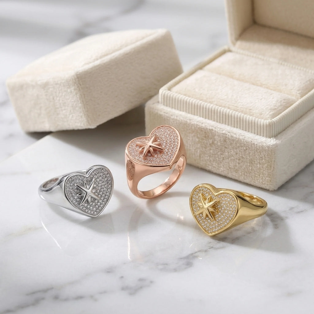 Three 925 silver pavé heart rings with cubic zirconia and star motifs displayed in a Dubai studio.