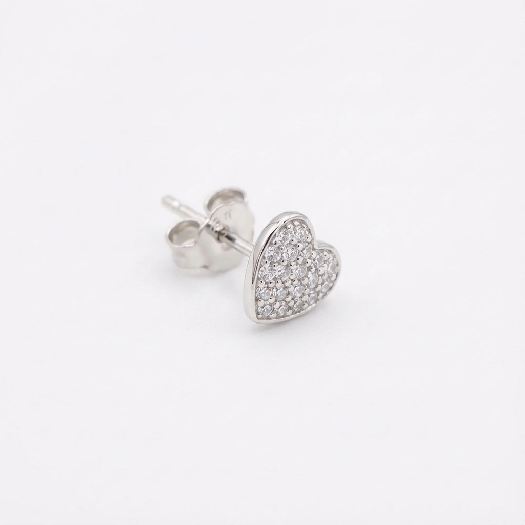 Side view of the pavé heart stud earring showing the polished post and butterfly back in 925 sterling silver.