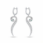 Paved serpent drop earrings in rhodium 925 silver — green CZ eye, mixed round and baguette cubic zirconia, white background