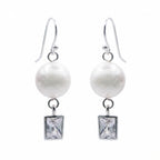 Pair of silver pearl drop earrings with bezel-set rectangular cubic zirconia on white
