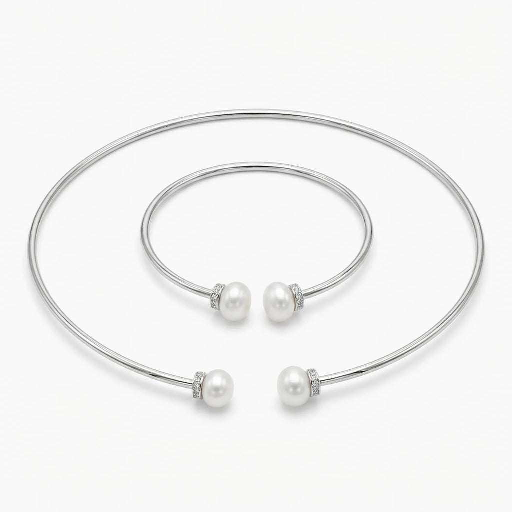 Front view of the Luna Dura pearl necklace set in 925 sterling silver featuring a torque choker and matching bangle with fresh water pearls.