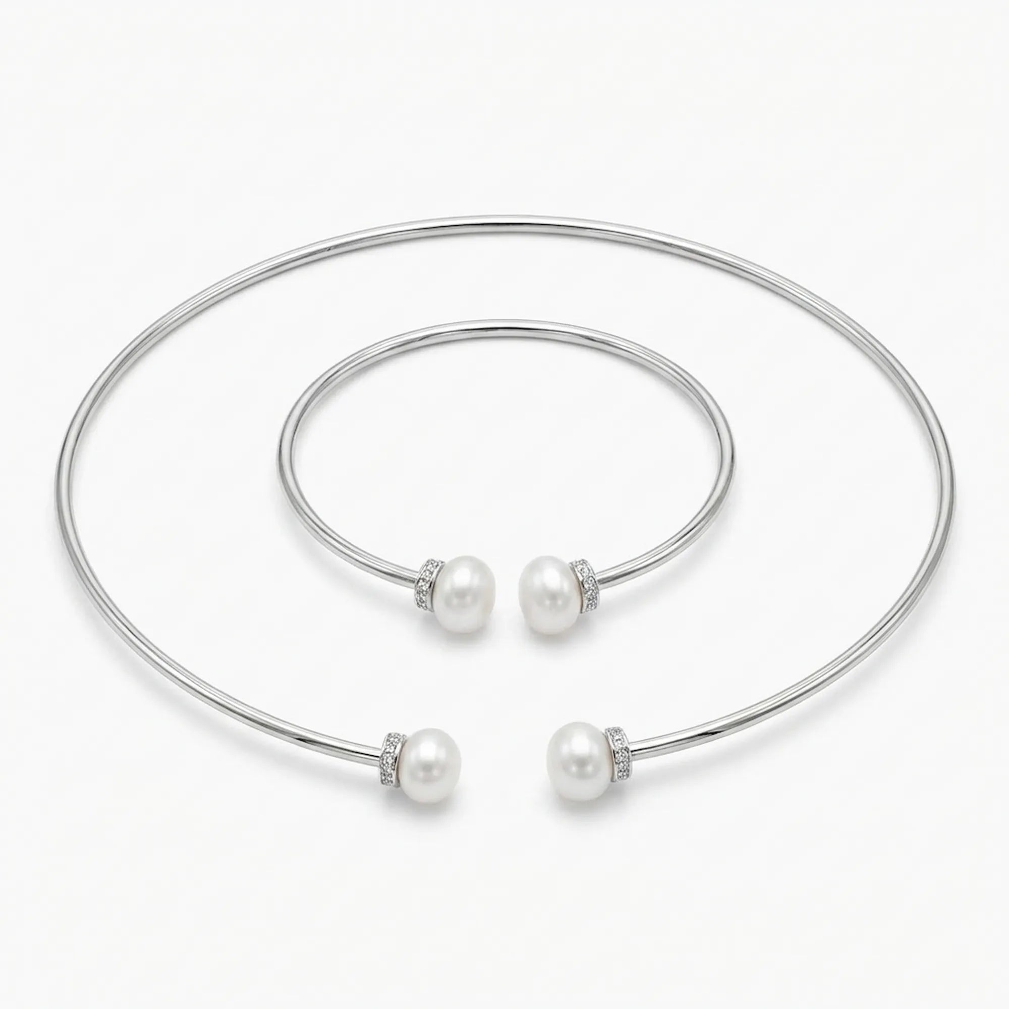 Front view of the Luna Dura pearl necklace set in 925 sterling silver featuring a torque choker and matching bangle with fresh water pearls.