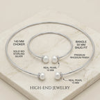 Technical breakdown of the pearl necklace set detailing the 140mm choker size, 55mm bangle fit, solid 925 silver material, and 10mm real pearls.