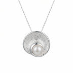 925 silver pearl vortex pendant necklace front view, textured disc with freshwater pearl centre