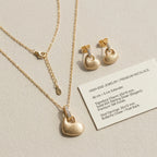 Puffed heart pendant and earring set with specifications card — 925 silver, 18K finish, dimensions and post-back