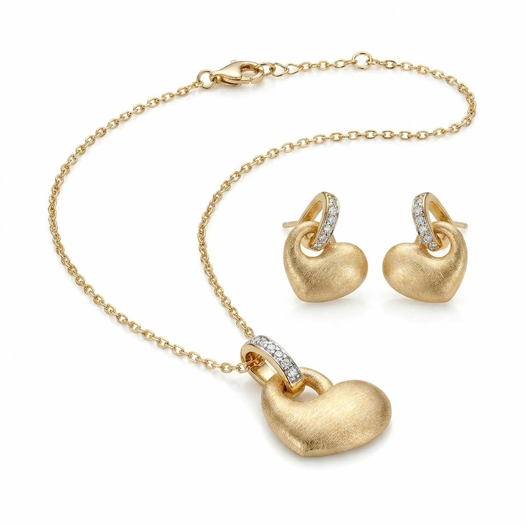 Matte satin 18K gold puffed heart pendant necklace and drop earrings in 925 sterling silver — white background